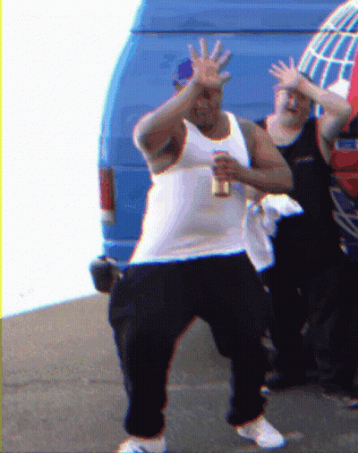A Man In A White Tank Top Holds A Can Of Beer GIF