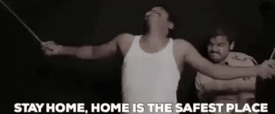 A Man In A White Tank Top Is Being Tortured By A Police Officer With A Stick . GIF