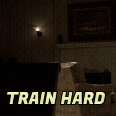 A Man In A White Tank Top Is Lifting A Dumbbell With The Words Train Hard Written Above Him GIF