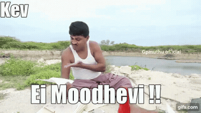 A Man In A White Tank Top Is Sitting On The Ground In Front Of A Body Of Water And Holding A Book . GIF