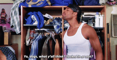 A Man In A White Tank Top Is Standing In Front Of A Closet And Says Yo Dogs GIF
