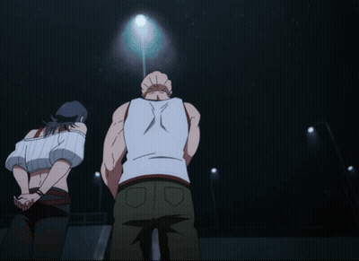 A Man In A White Tank Top Is Standing In Front Of A Woman GIF