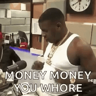A Man In A White Tank Top Is Talking Into A Microphone In Front Of A Clock And A Clock . GIF