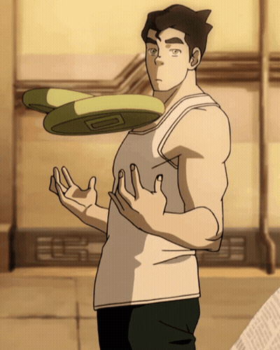 A Man In A White Tank Top Is Throwing A Frisbee In The Air GIF