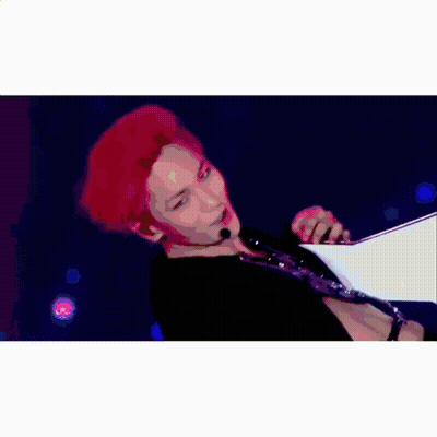 A Man In A White Tank Top Is Walking Down A Hallway With Nylon Tv Korea Written On The Bottom GIF