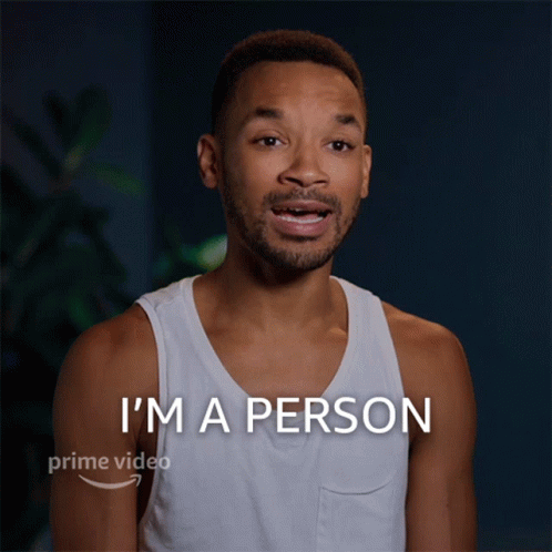 A Man In A White Tank Top Says " I 'M A Person " In A Prime Video Ad GIF