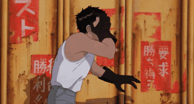 A Man In A White Tank Top Stands In Front Of A Yellow Wall With Chinese Writing On It GIF