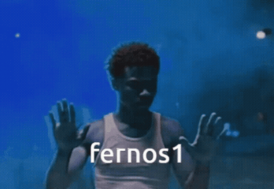 A Man In A White Tank Top With Fernos1 Written On The Bottom GIF