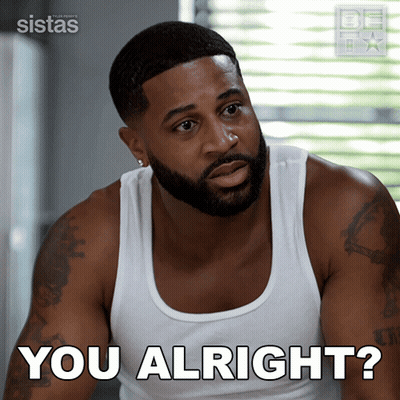 A Man In A White Tank Top With The Words You Alright Below Him GIF
