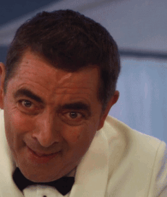 A Man In A White Tuxedo And Black Bow Tie GIF