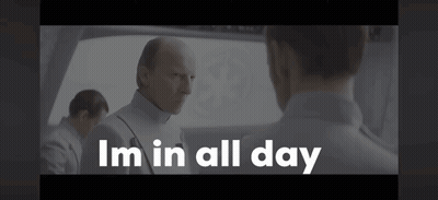 A Man In A White Uniform Is Talking To Another Man And The Words I 'M In All Day Are Above Him . GIF
