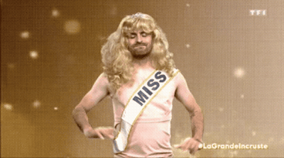 A Man In A Wig And Sash That Says Miss GIF