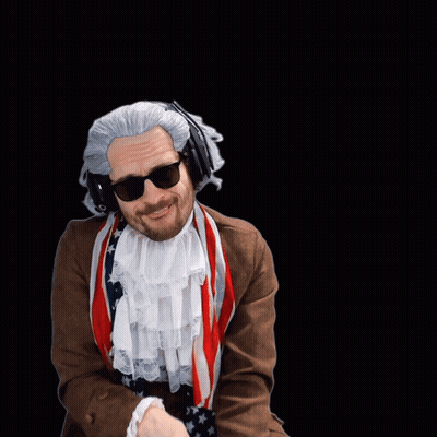 A Man In A Wig And Scarf Is Dancing GIF