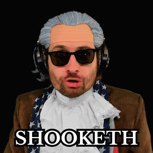 A Man In A Wig And Sunglasses Has The Word Shooketh On His Face GIF