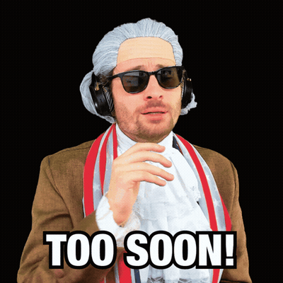 A Man In A Wig And Sunglasses Has The Words Too Soon Written On His Face GIF