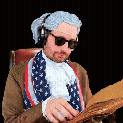 A Man In A Wig And Sunglasses Is Reading A Piece Of Paper GIF