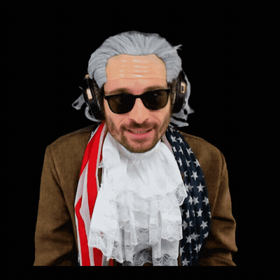 A Man In A Wig And Sunglasses Is Wearing Headphones And An American Flag Scarf GIF