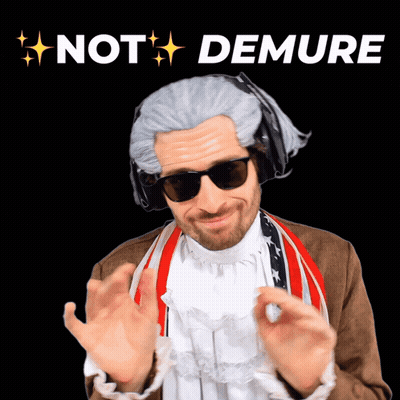 A Man In A Wig And Sunglasses With The Words Not Demure Above Him GIF