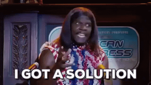 A Man In A Wig Is Standing In Front Of A Microphone And Saying `` I Got A Solution `` . GIF
