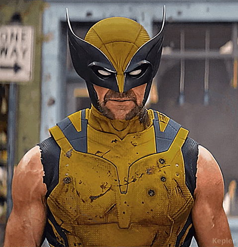 A Man In A Wolverine Costume Is Standing In Front Of A Sign That Says One Way GIF