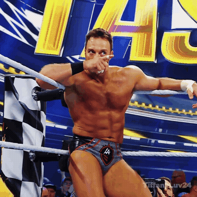 A Man In A Wrestling Ring Covering His Face With His Hand GIF