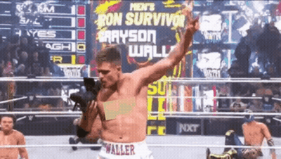 A Man In A Wrestling Ring Is Wearing Shorts That Say Waller On Them GIF