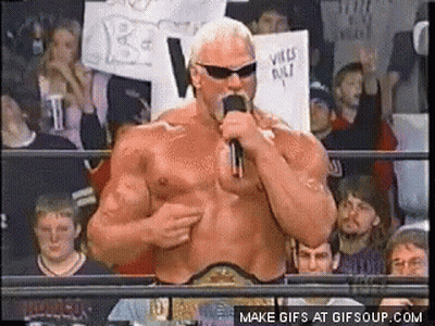 A Man In A Wrestling Ring Talking Into A Microphone GIF