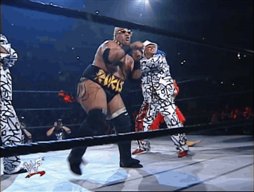 A Man In A Wrestling Ring With A Belt That Says ' Rvck ' On It GIF