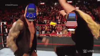 A Man In A Wrestling Ring With A Car On His Head GIF