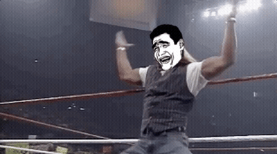 A Man In A Wrestling Ring With A Cartoon Face On His Face . GIF