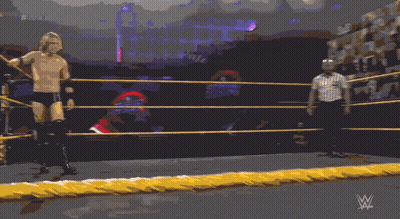 A Man In A Wrestling Ring With A Referee Behind Him And # 20 On The Screen GIF