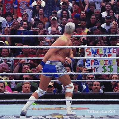 A Man In A Wrestling Ring With A Sign That Says Sweetie Stap Spending My $$ GIF