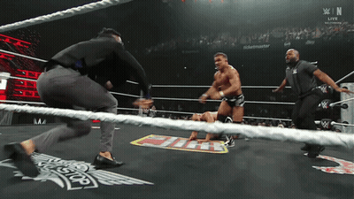 A Man In A Wrestling Ring With A Sign That Says ' Ticketmaster ' On It GIF