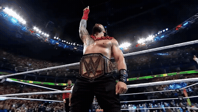 A Man In A Wrestling Ring With A W Belt On GIF