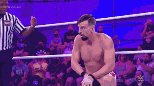 A Man In A Wrestling Ring With A W Logo On The Bottom GIF