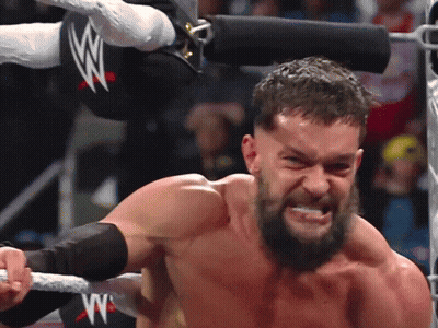 A Man In A Wrestling Ring With A W Logo GIF