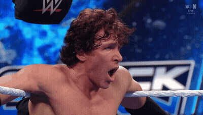 A Man In A Wrestling Ring With His Mouth Open GIF