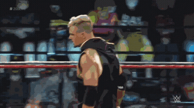 A Man In A Wrestling Ring With The Hashtag # 205Live In The Corner GIF