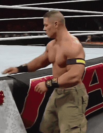 A Man In A Wrestling Ring With The Letter A On The Side Of Him GIF