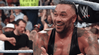 A Man In A Wrestling Ring With The Letter W On His Hat GIF