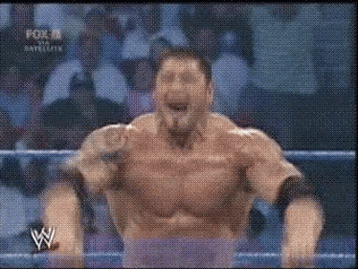 A Man In A Wrestling Ring With The Letter W On The Bottom Right GIF