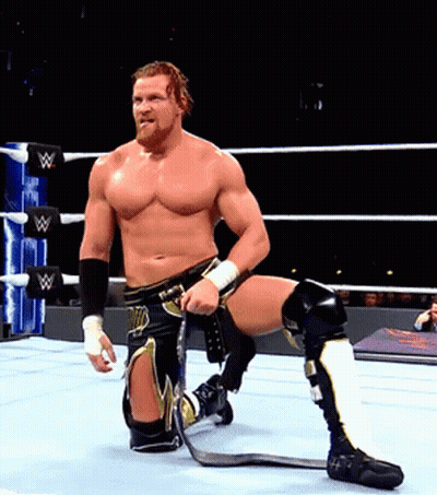 A Man In A Wrestling Ring With The Letter W On The Ring Ropes GIF