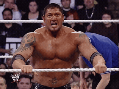 A Man In A Wrestling Ring With The Letter W On The Rope GIF
