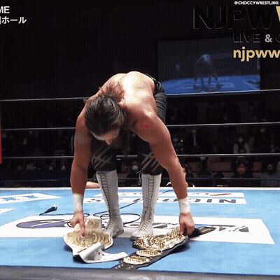 A Man In A Wrestling Ring With The Njpw Logo On The Bottom GIF