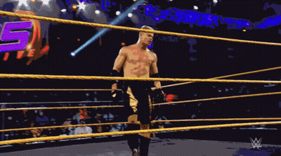 A Man In A Wrestling Ring With The Number 15 In The Back GIF