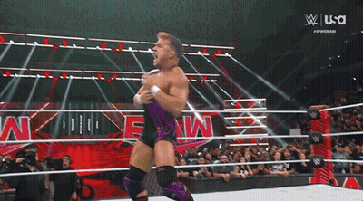 A Man In A Wrestling Ring With The Usa Logo On The Bottom Right GIF