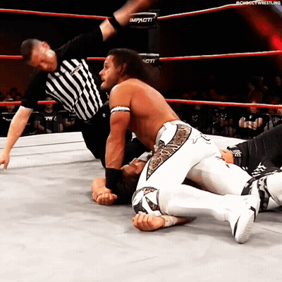 A Man In A Wrestling Ring With The Word Impact On The Side GIF