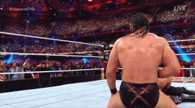 A Man In A Wrestling Ring With The Word Live On The Screen GIF
