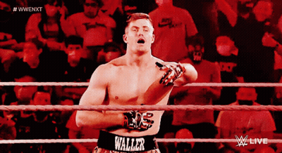 A Man In A Wrestling Ring With The Word Waller On His Waist GIF