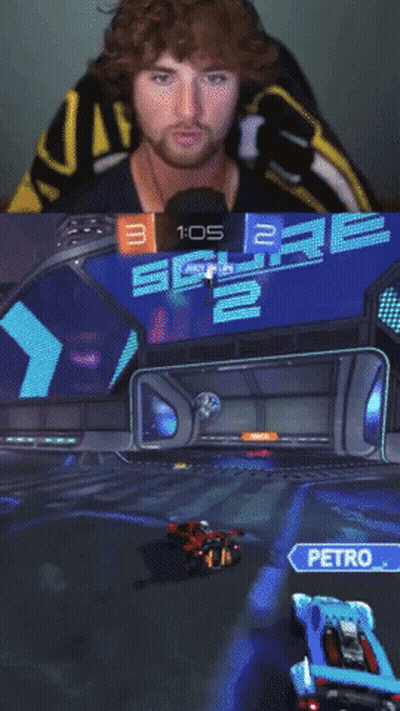 A Man In A Yellow And Black Shirt Is Playing A Video Game GIF